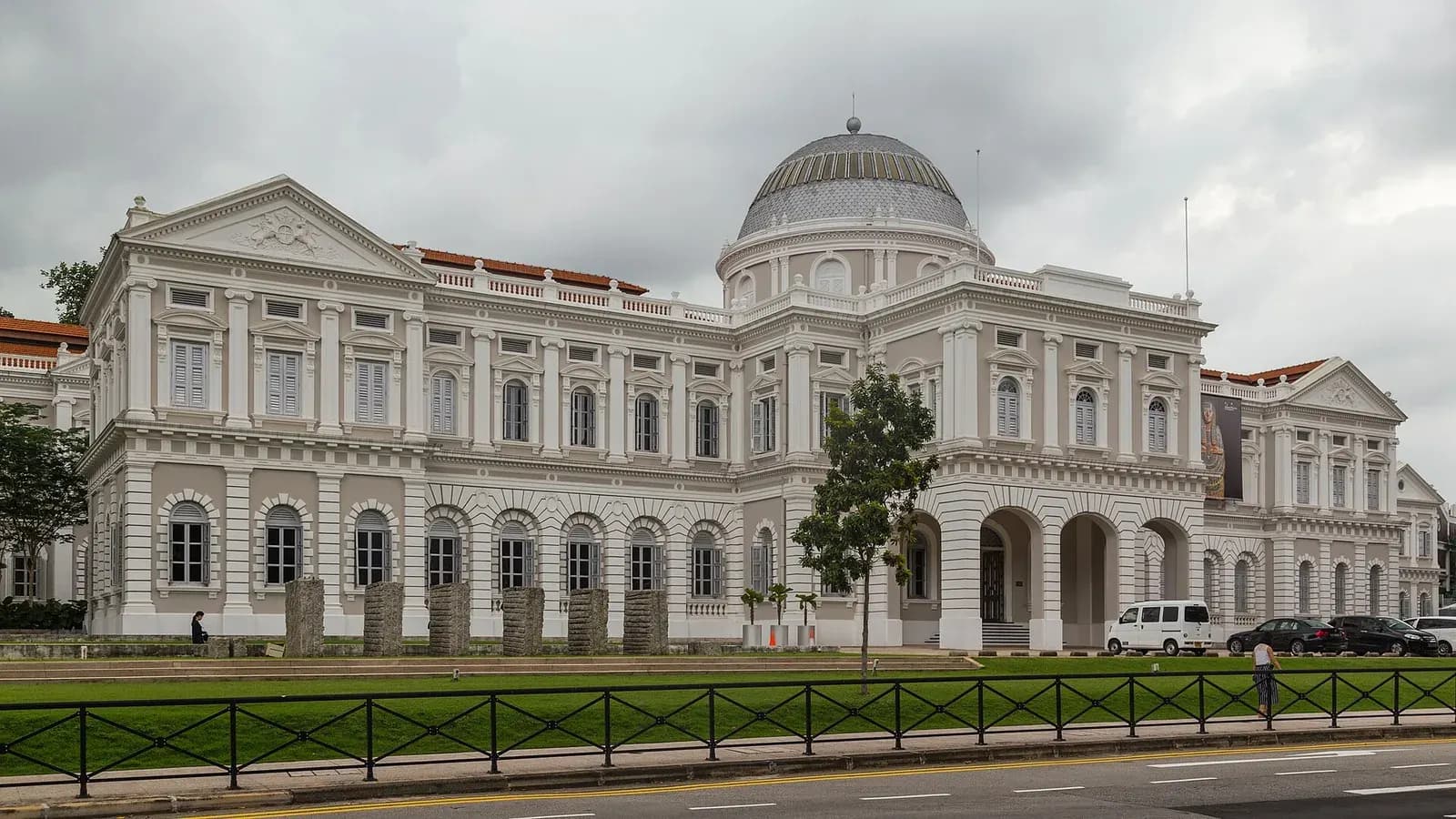 White colonial facade and dome of the National Museum of Singapore on Stamford Road