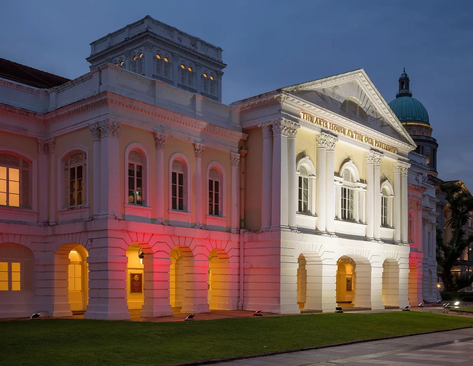 The Arts House at the Old Parliament lit up at blue hour
